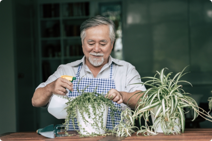 senior-man-plant-tree-home